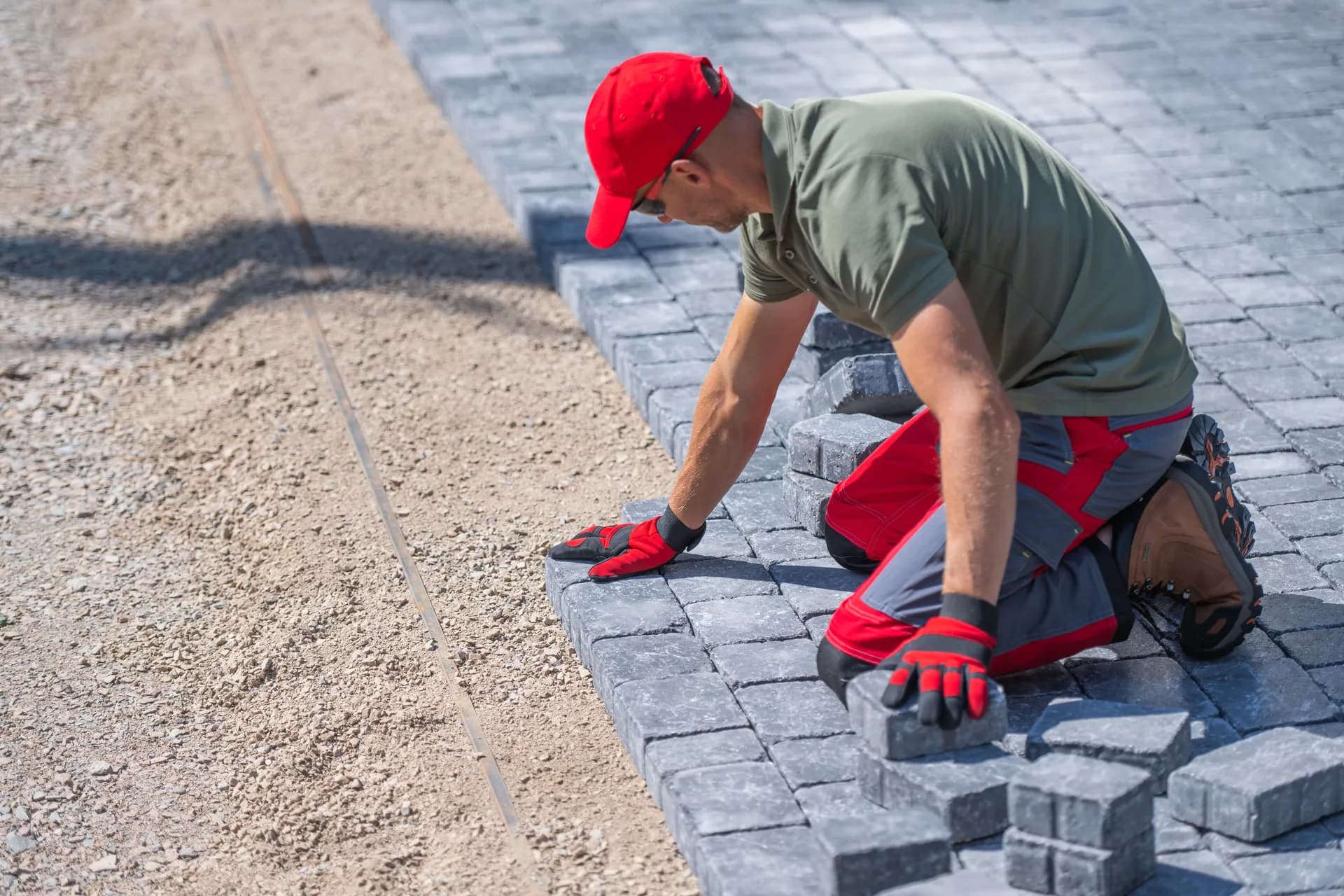 Professional installer preparing a paver base in Manatee County, FL